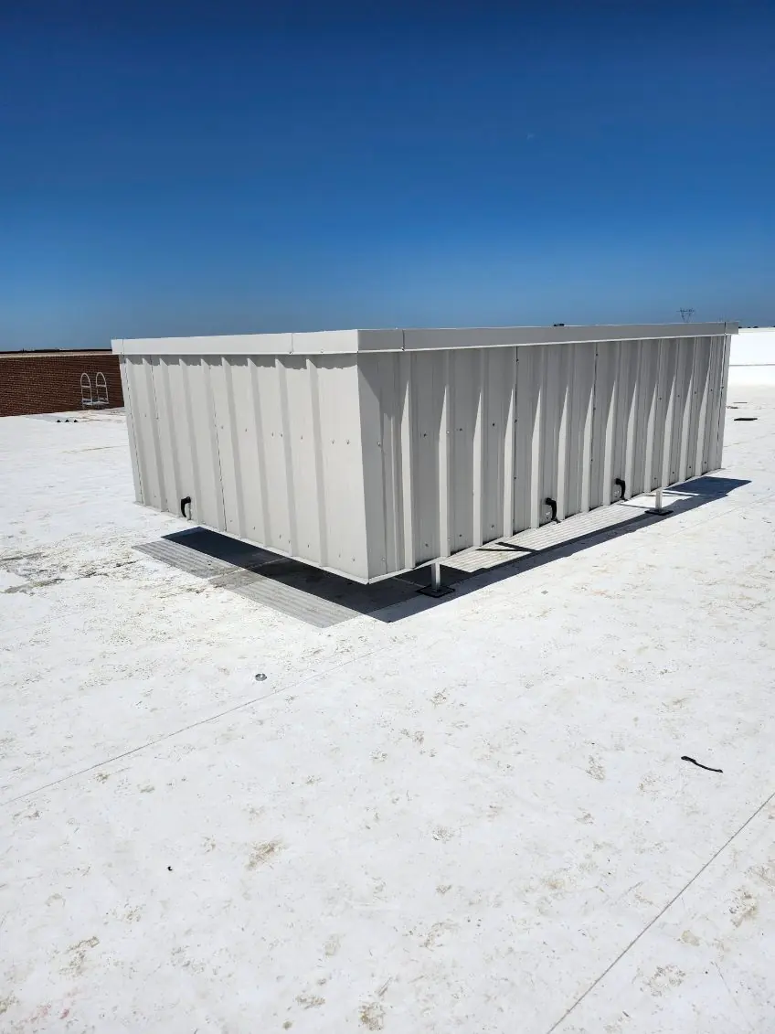 Ash gray V-PBR metal screen panels concealing rooftop mechanical equipment