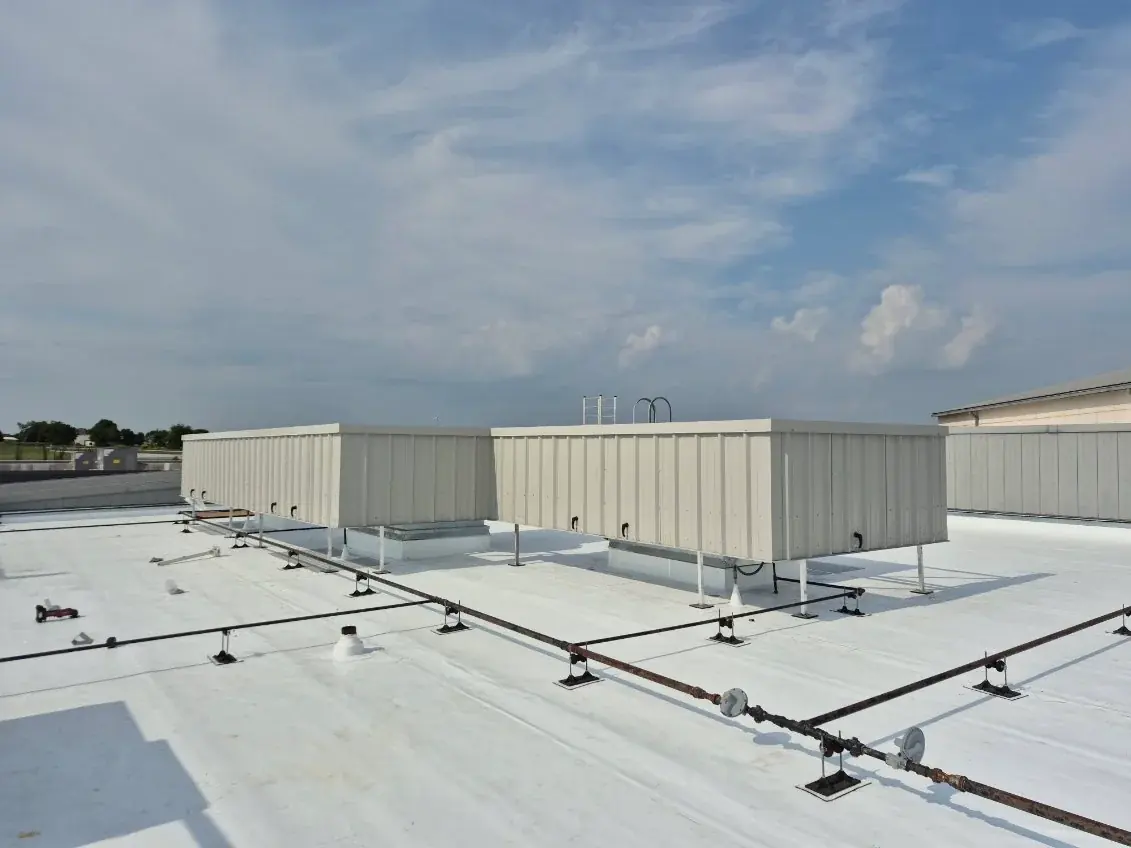 RTU screen support framing and posts carrying two rooftop screen enclosures