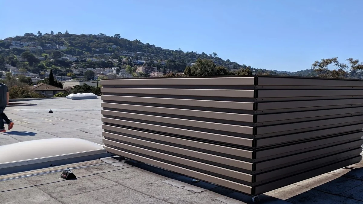 Mechanical equipment screens on a commercial rooftop HVAC enclosure